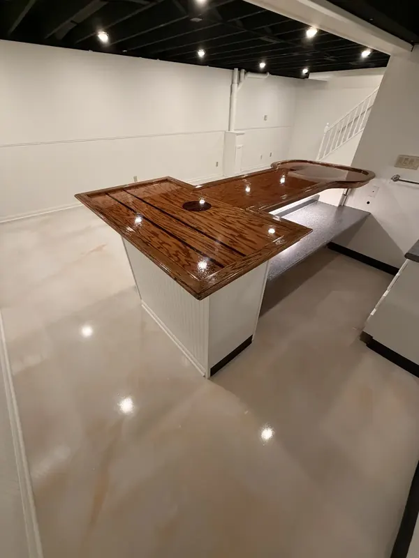 Basement bar with a glossy coated floor