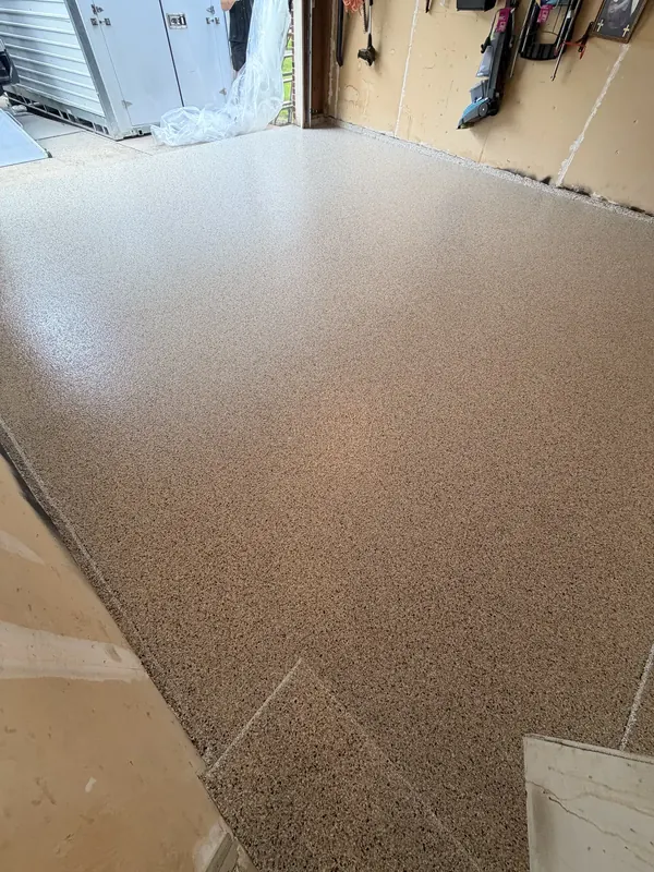 Beige flake floor in the corner of a garage