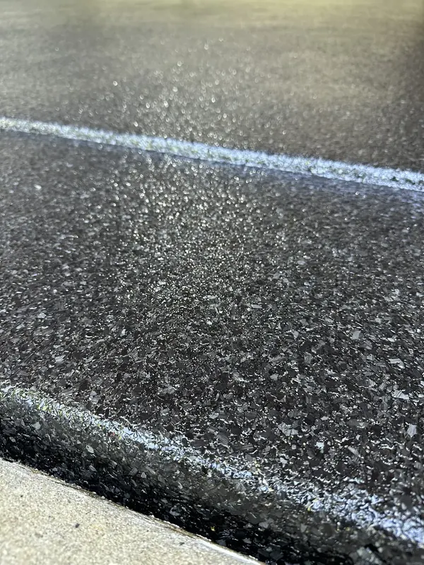 Close up of black flake coating