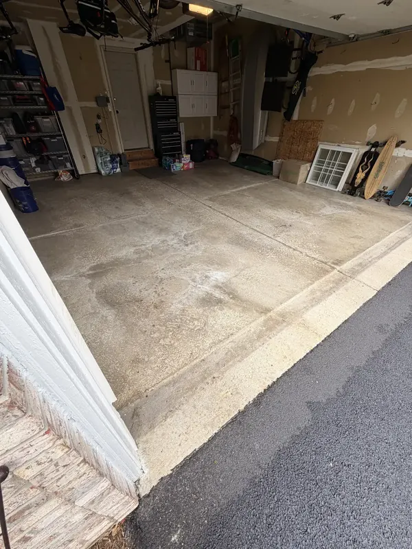 Worn garage slab before coating