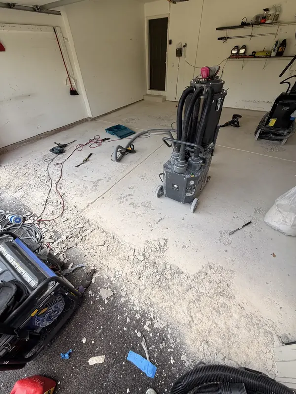 Concrete repair debris and a vacuum