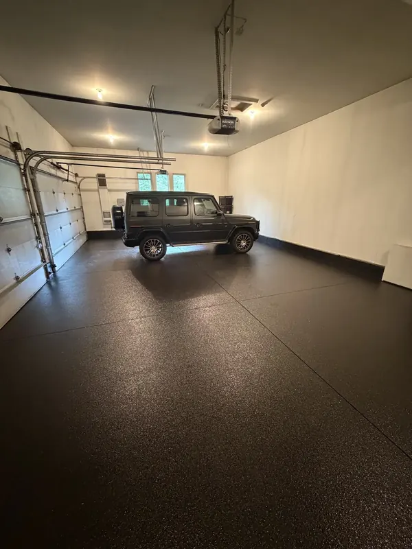 SUV parked on a dark coated floor