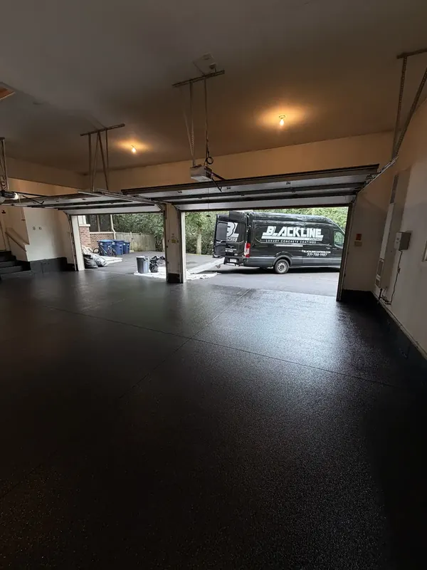 Finished black floor in a three bay garage