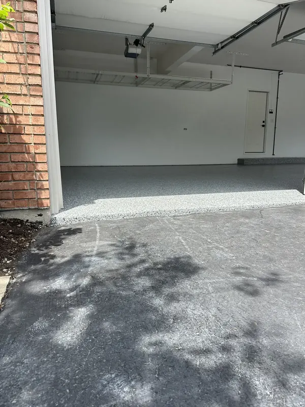 Speckled coating at a garage doorway