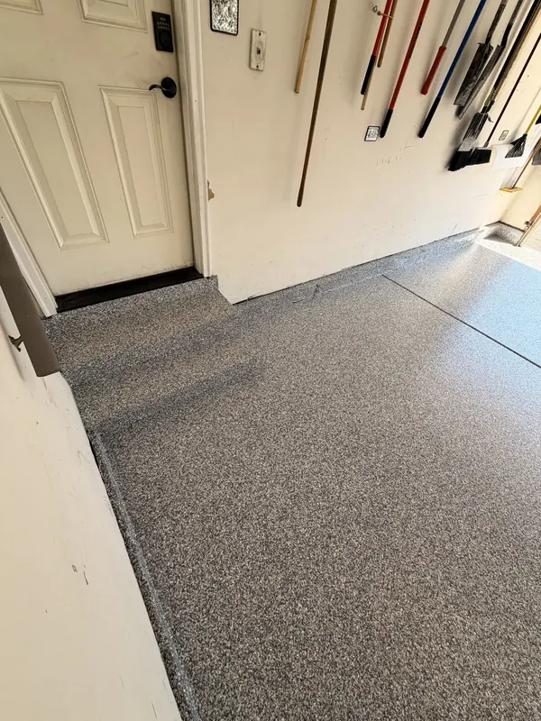 Grey flake floor beside an entry door