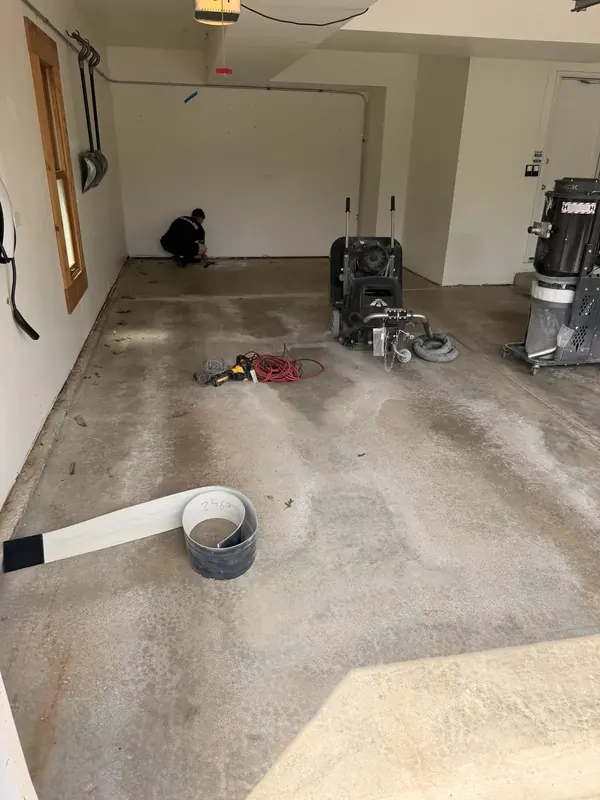 Grinding prep in an empty garage