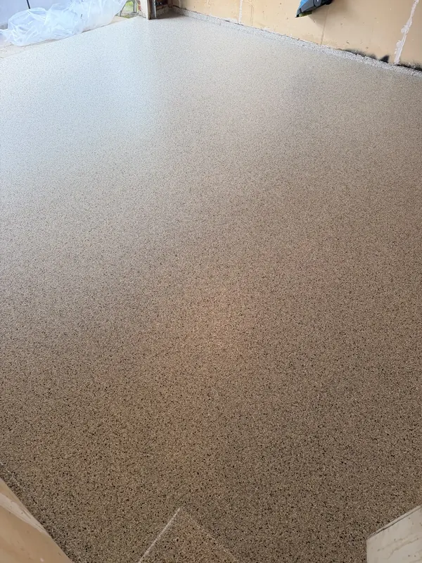 Tan flake coating on a garage floor