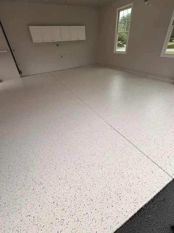 White flake floor with garage cabinets