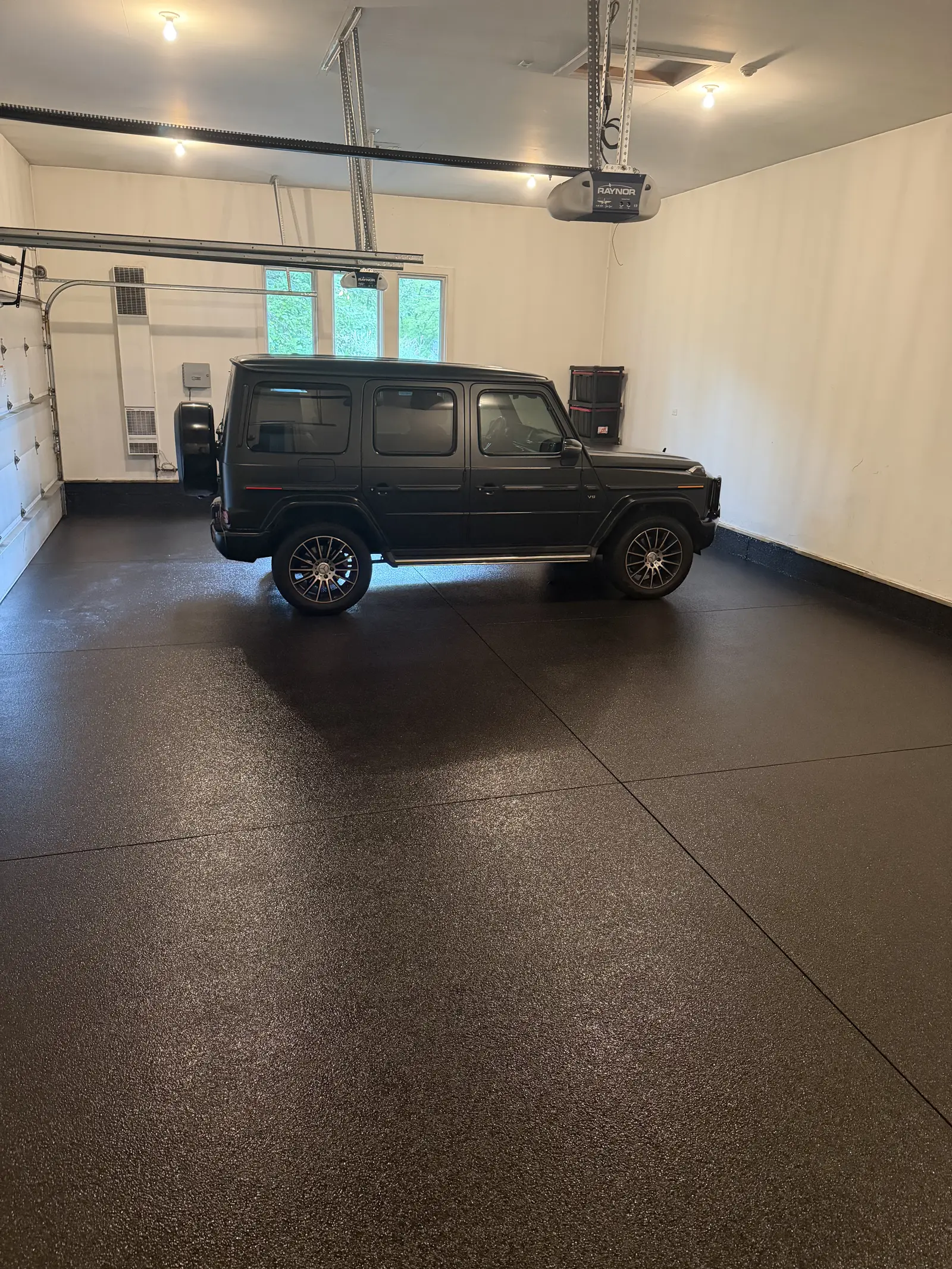 Mercedes G Wagon parked on a dark flake coated garage floor