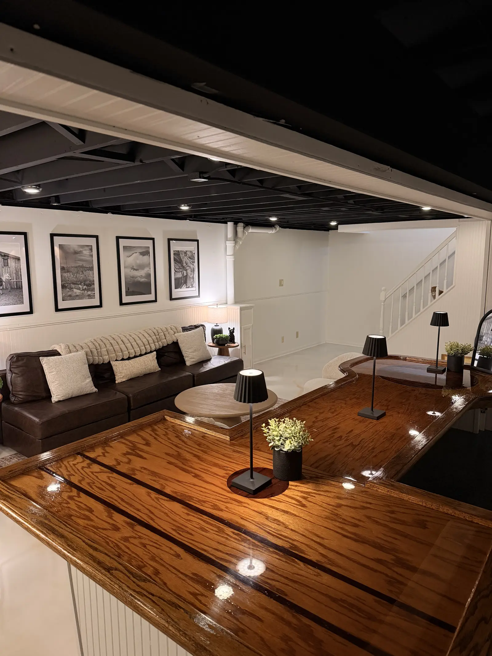 Pearl marble metallic floor running through a finished lower level lounge