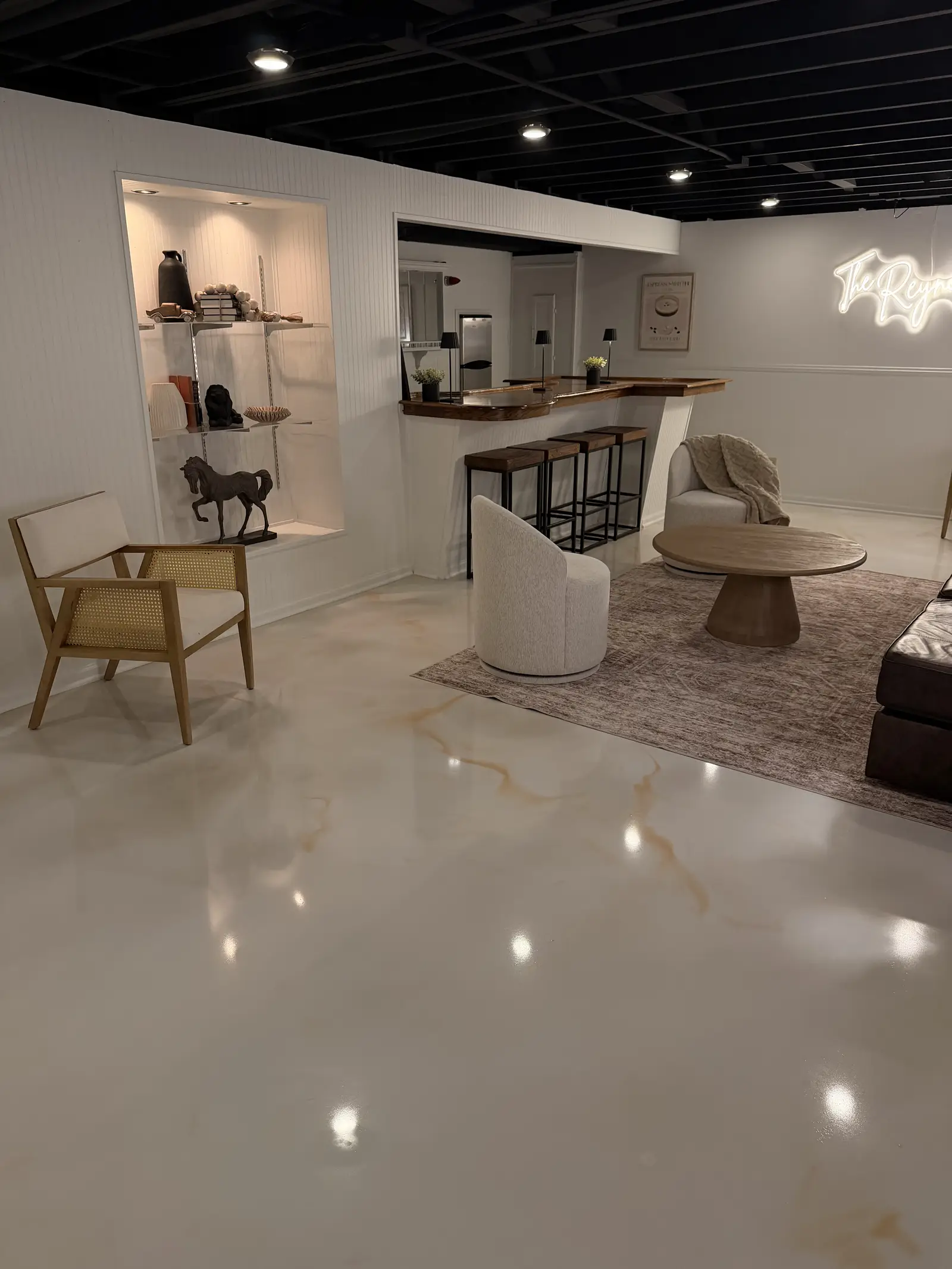 Marble metallic floor reflecting ceiling lights in a finished retail space
